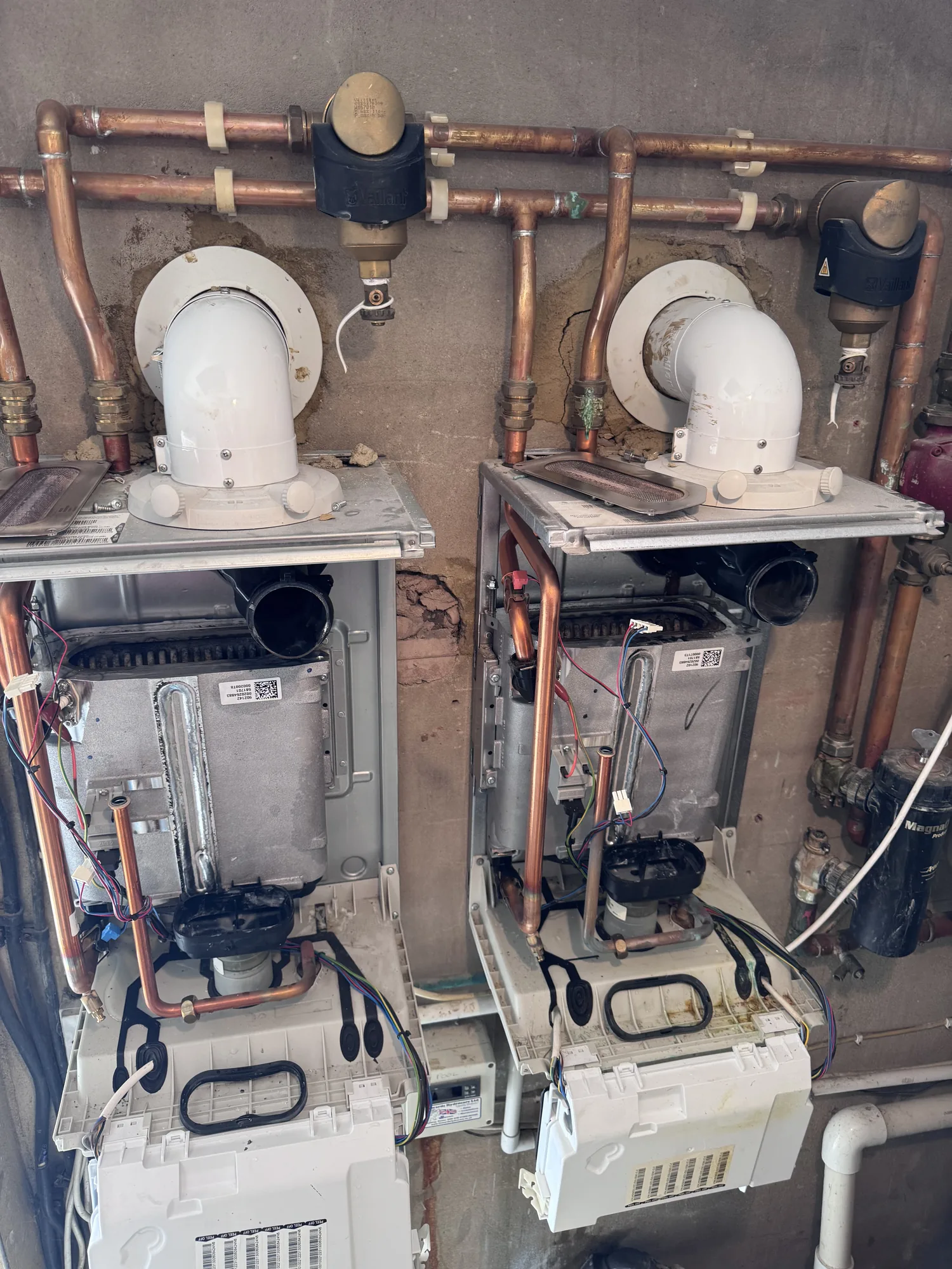 Twin boiler heating system with extensive copper pipework